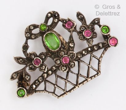 null A yellow gold and silver flower basket brooch set with stones. Gross weight:...
