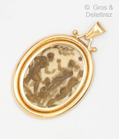 null A yellow gold pendant with an intaglio representing Plato teaching under his...