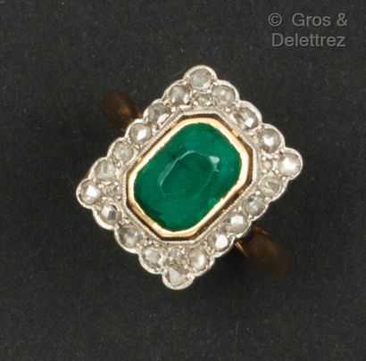 null Yellow and white gold ring set with a green stone in a rectangular setting of...