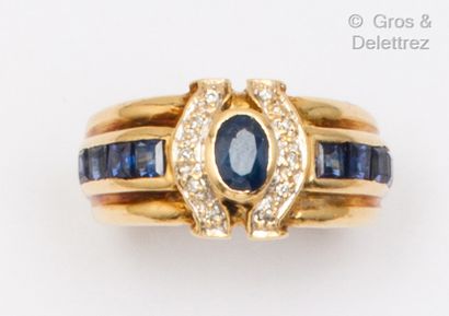 null Yellow gold ring set with a round sapphire, brilliant-cut diamonds and lines...