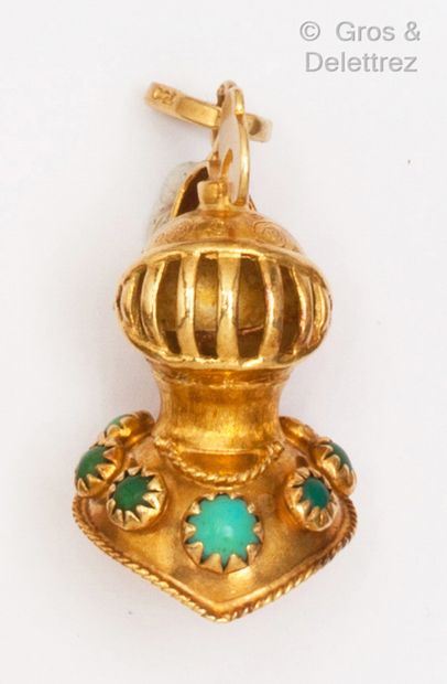  Pendant "Heaume" in yellow gold, underlined by turquoise cabochons. Length : 3,2...