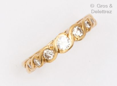 null Yellow ring, set with a fall of brilliant-cut diamonds in an interlace setting....