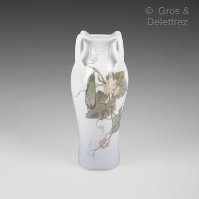 null Porcelain vase with four handles decorated in polychrome enamel with flowering...