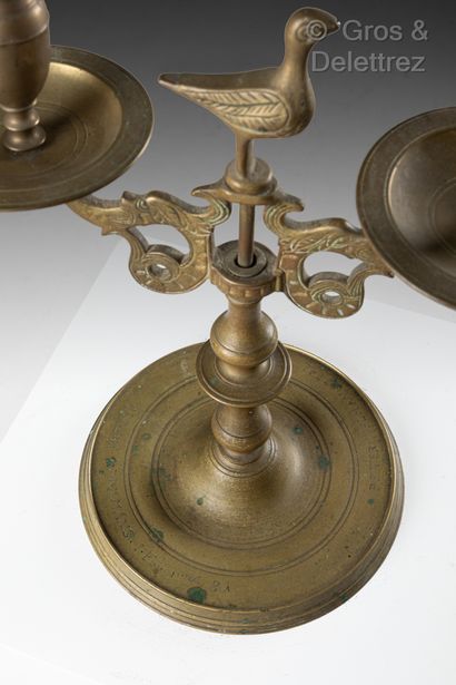 null Two bronze candlesticks, two arms, circular base with inscriptions PETER HELMAN...
