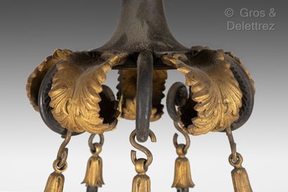 null A gilded and patinated bronze chandelier with ten arms of lights ending with...