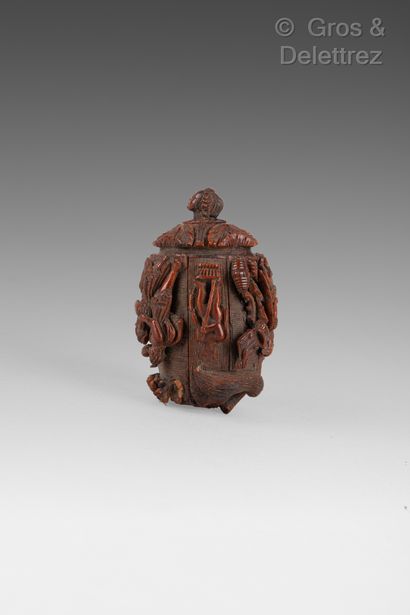null Shaker made of carved corozo nut with a rotating decoration of gods and putti...