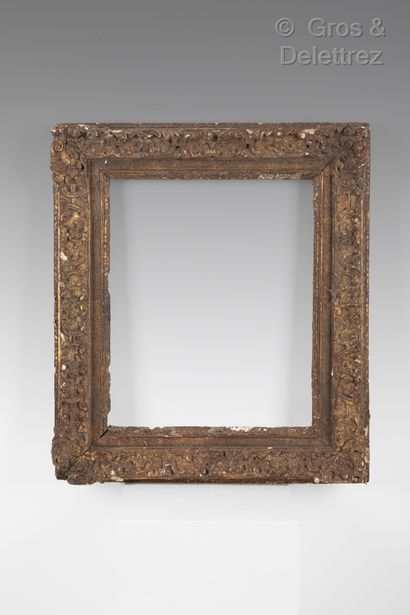 Carved and gilded oak frame with Bérain decoration...