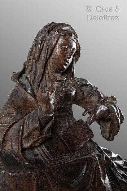 null 
Virgin of the Annunciation in carved oak, hollowed out back, part of an altarpiece....
