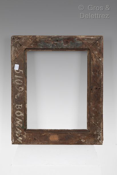 null Carved and gilded oak frame decorated with culots and lambrequins.

Louis XIV...