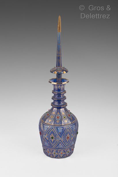 null Bohemian for the Iranian market.

A blue tinted glass bottle decorated with...