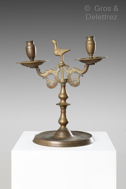 null Two bronze candlesticks, two arms, circular base with inscriptions PETER HELMAN...