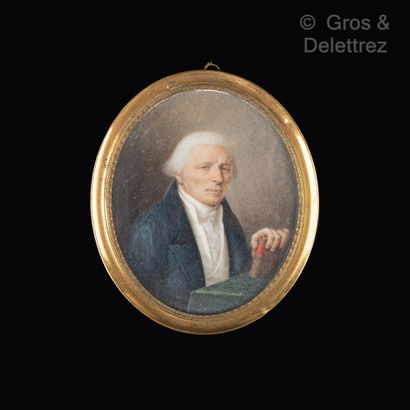 null Oval miniature showing an old man in a blue frock coat holding a book. Signed...