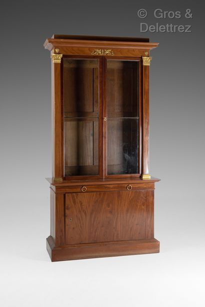 null Pair of straight mahogany veneered bookcases, the lower part opening with a...