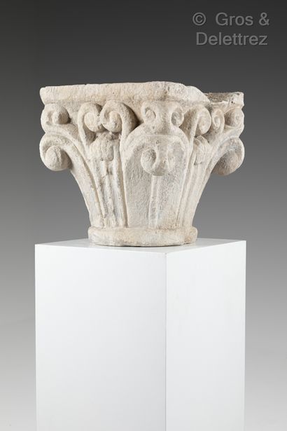 null Limestone capital carved on all sides with smooth leaves, hooks in the corners...