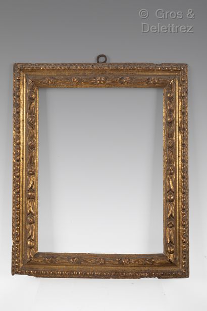 null A carved and gilded wood frame with an upside down profile and leaves.

Northern...
