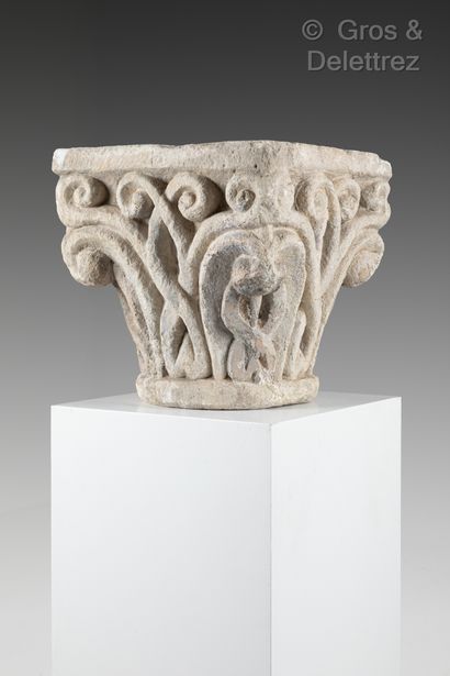 null Limestone capital carved on all sides with interlacing decoration, corners with...