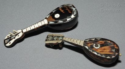 null Meeting of miniature stringed musical instruments in tortoiseshell, mother-of-pearl...
