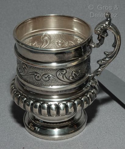 null Silver lot:

- Pedestal cup with gadroon decoration;

- Cup with two handles;

-...