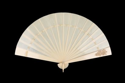  Ivory Whiteness, circa 1890 Broken type ivory fan*. The plume decorated with a figure...