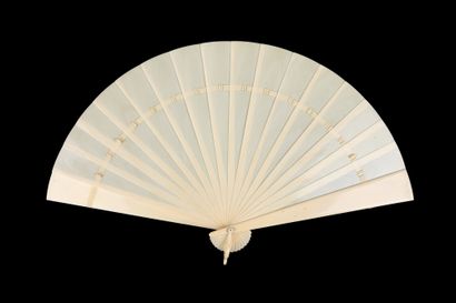  Ivory Whiteness, circa 1890 Broken type ivory fan*. The plume decorated with a figure...