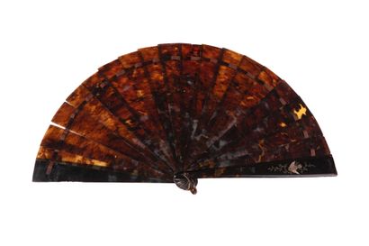 null The bird and the butterfly, circa 1890
Brown tortoiseshell fan** engraved with...