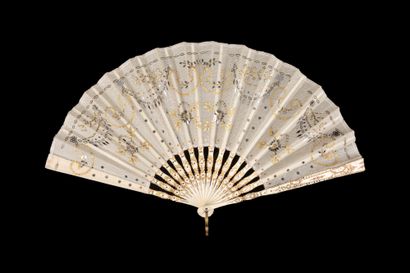  Empire spirit, Europe, circa 1900-1910 Folded fan, the leaf embroidered with scrolls,...