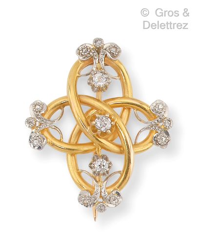 null Yellow gold "Knot" brooch with scroll decoration set with old-cut diamonds....