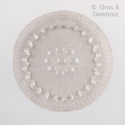 null Glass plate with engraved decoration of floral scrolls and central starry motif....