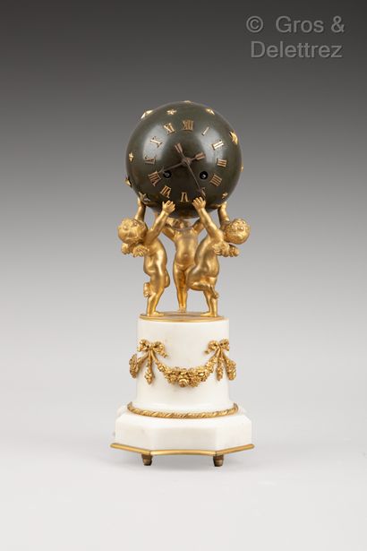null Gilt bronze clock featuring three lovers supporting a starry globe on a cylindrical...
