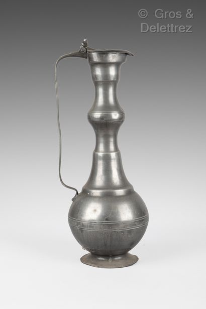 Lot of old pewter composed of a high pitcher,...