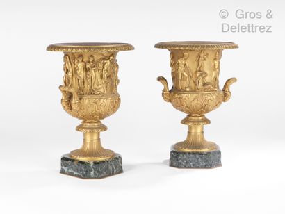 null Pair of gilt bronze medicis vases on a green marble base, decorated with antique...