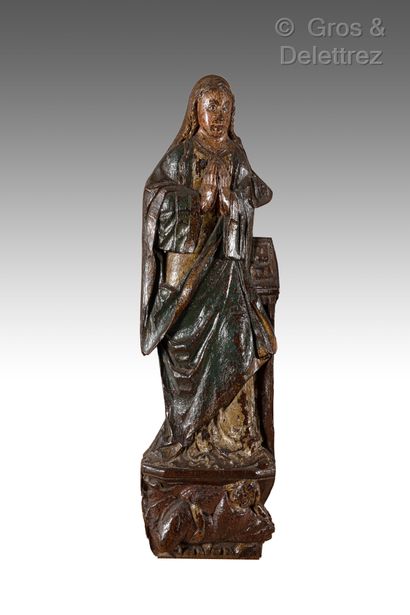 Saint Catherine in wood carved in low relief....