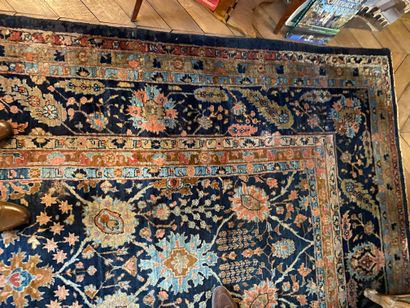  Large Tabriz carpet with blue background and radiating flowers 
Iran, early 20th...