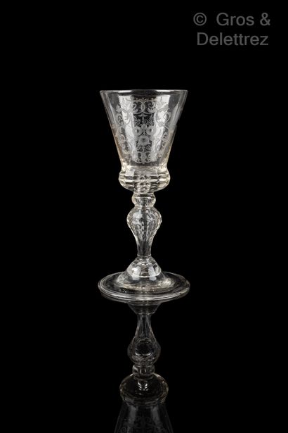 null Glass truncated cone with engraved decoration of a broad leafy cartouche. It...
