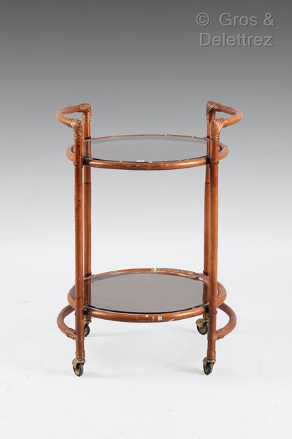 null Rattan pedestal table with wheels and two circular glass trays. 78 x D : 56...