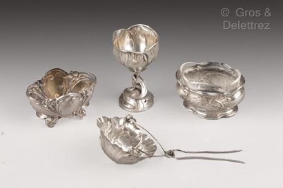 null Lot composed of two saltcellars, a pass-tea and an eggcup in silver of art nouveau...