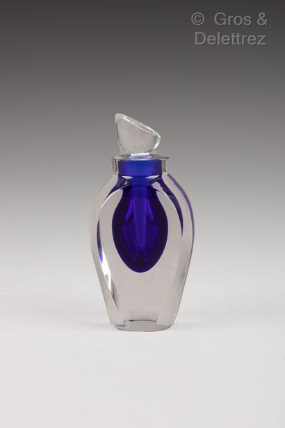 null Covered bottle in translucent crystal and tinted with a blue drop. Signed, dated...