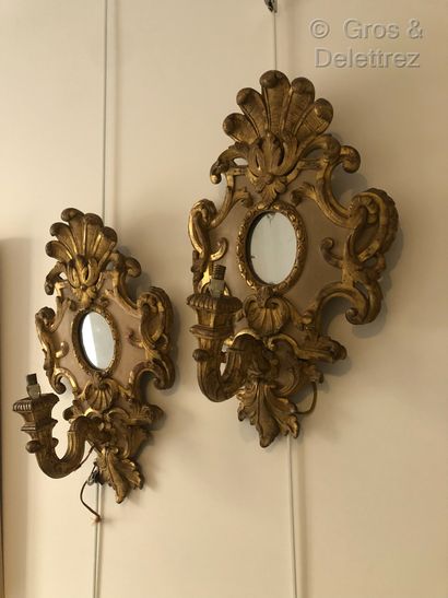 null Suite of four Regency style carved and gilded wood sconces with a light arm...