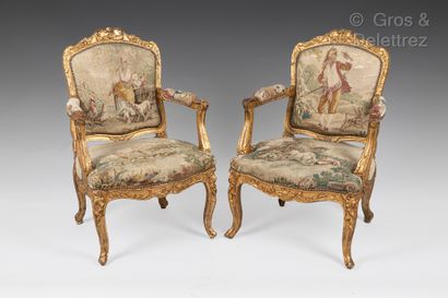 Pair of armchairs in carved and gilded wood....