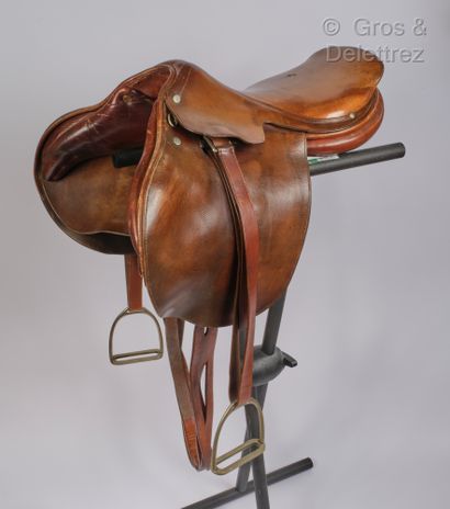HERMES Paris Brown leather saddle, palladium-plated silver metal saddle studs, adjustable...