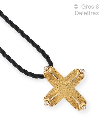 null Yellow gold guilloche "Cross" pendant, adorned at each end with a spade set...