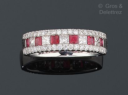null White gold wedding band, set with calibrated rubies alternated with princess...