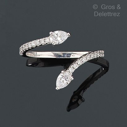 null You and Me" ring in white gold, set with pear-shaped diamonds and lines of brilliant-cut...