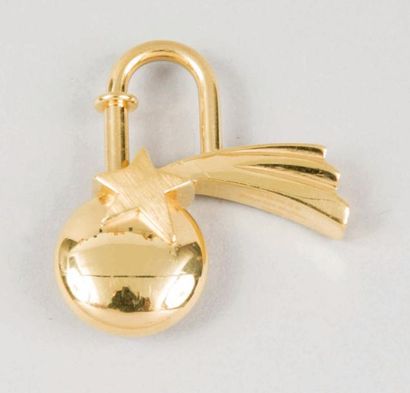 HERMES Paris made in France Porte clefs en métal doré figurant une comète et titré...