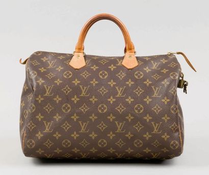 Louis VUITTON Sac "Speedy" 35 cm en toile monogram et cuir naturel, fermeture éclair,...