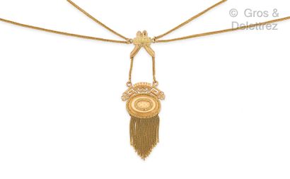 null Yellow gold necklace made of chains, holding a chiseled, openwork and carved...