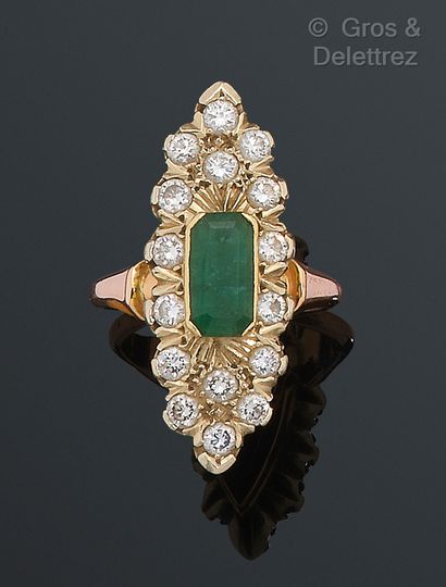 null Yellow gold "Navette" ring, set with an emerald in a circle of brilliant-cut...