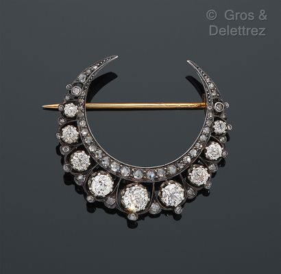 null Yellow gold and silver "Crescent" brooch, set with a fall of old cut diamonds,...
