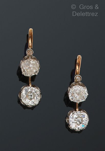 null Pair of "Dormeuses" earrings in pink gold, each adorned with two old-cut diamonds....