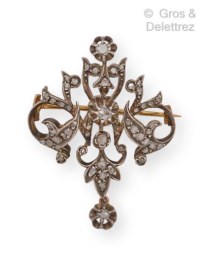 null Gold and silver "Volute" brooch set with diamonds, holding a diamond as a pendant....